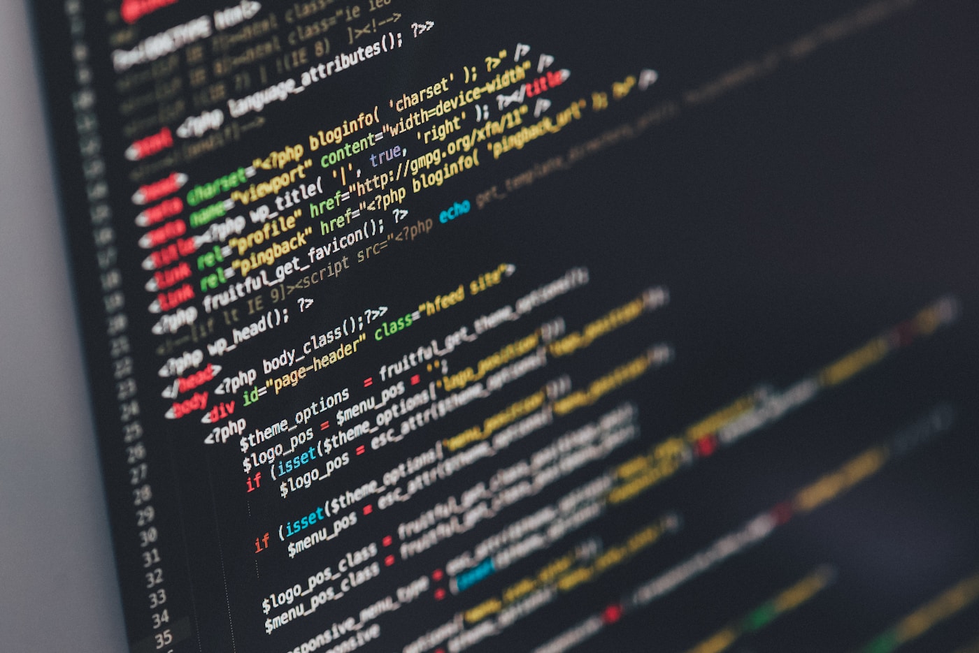 Developer working on code on a laptop screen