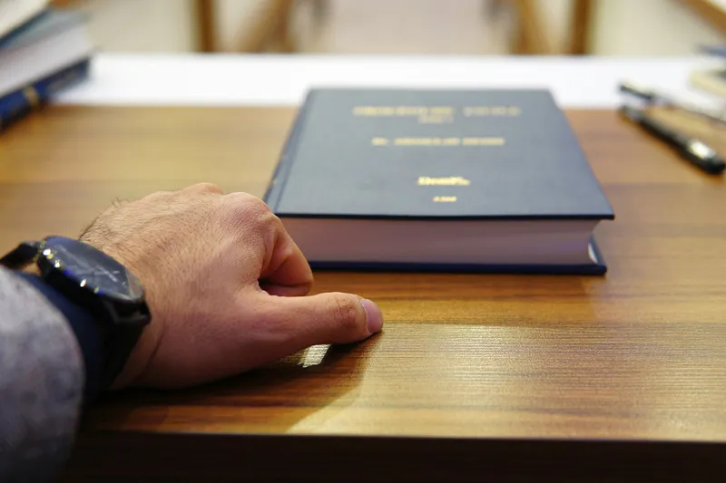 Lawyer reviewing legal documents at a desk