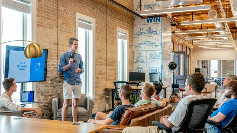 Sales professional presenting a pitch deck in a meeting room