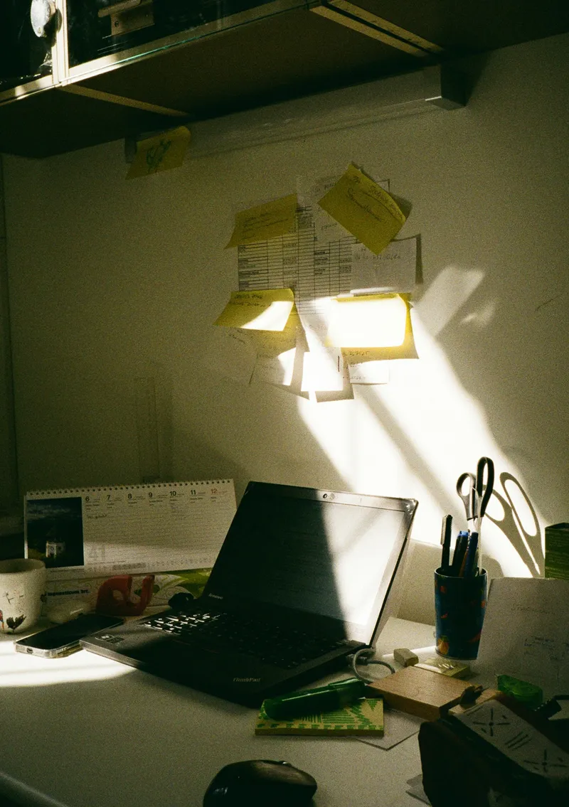 Desk with laptop and sticky notes